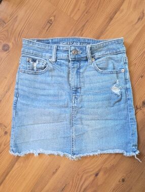 American Eagle Outfitters Light Blue Distressed Denim Mini Skirt with Raw Hem